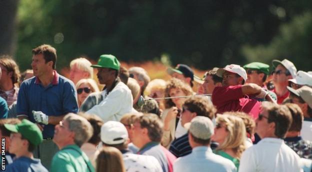 Tiger Woods and Nick Faldo on course