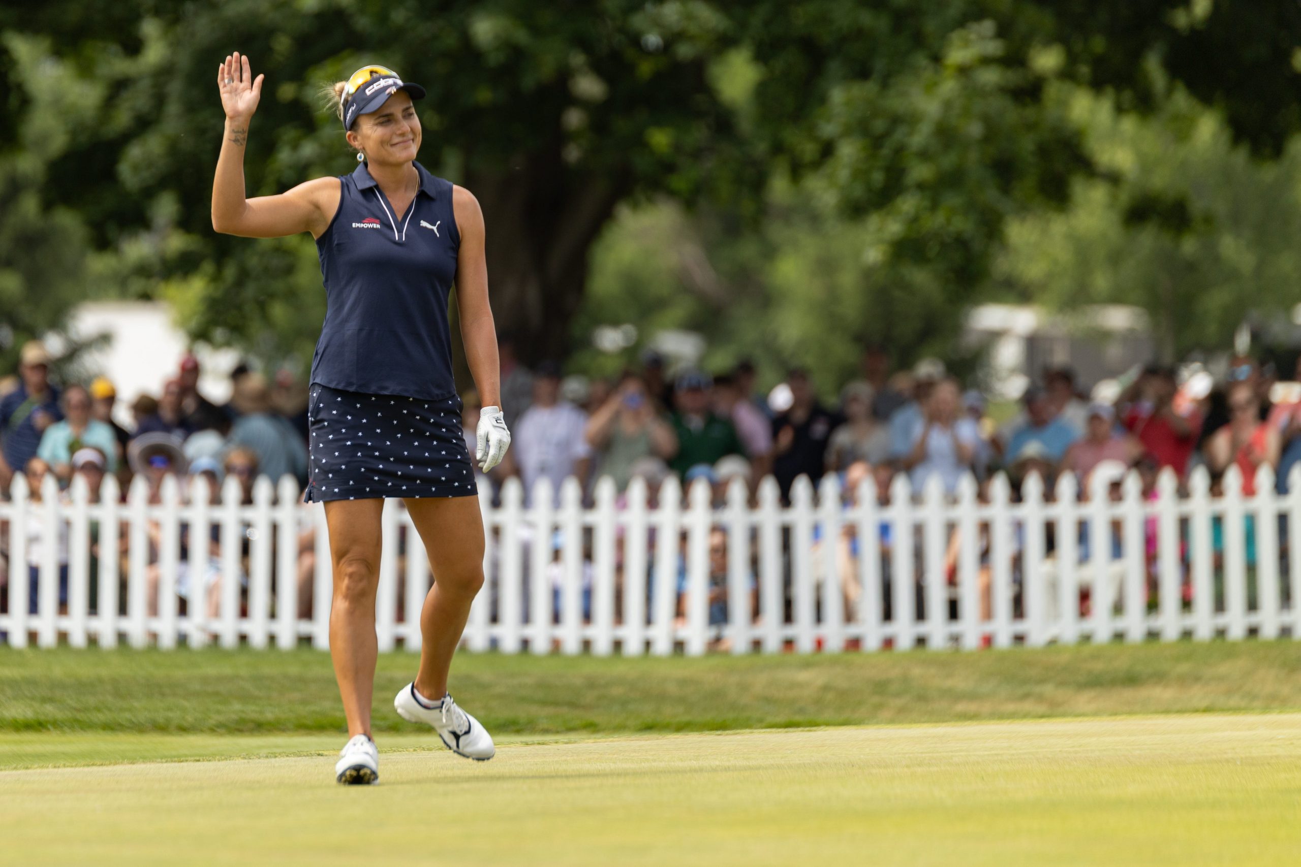 Lexi Thompson waves to the crowd after finishing the 18th hole during the LPGA Classic on June 15, in Grand Rapids.
